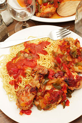 Cooked tomatoes sweeten this wonderful Chicken Cacciatore dinner.